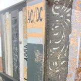 Close-up detail shot of vintage books with raised metallic paper.