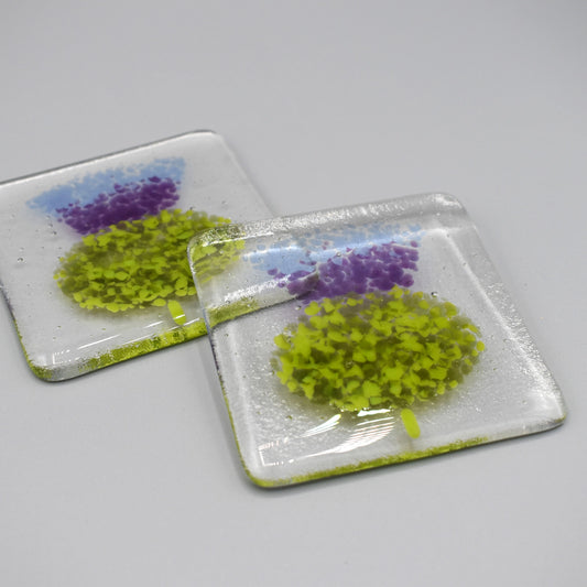 Clear glass square coasters with purple thistle design 