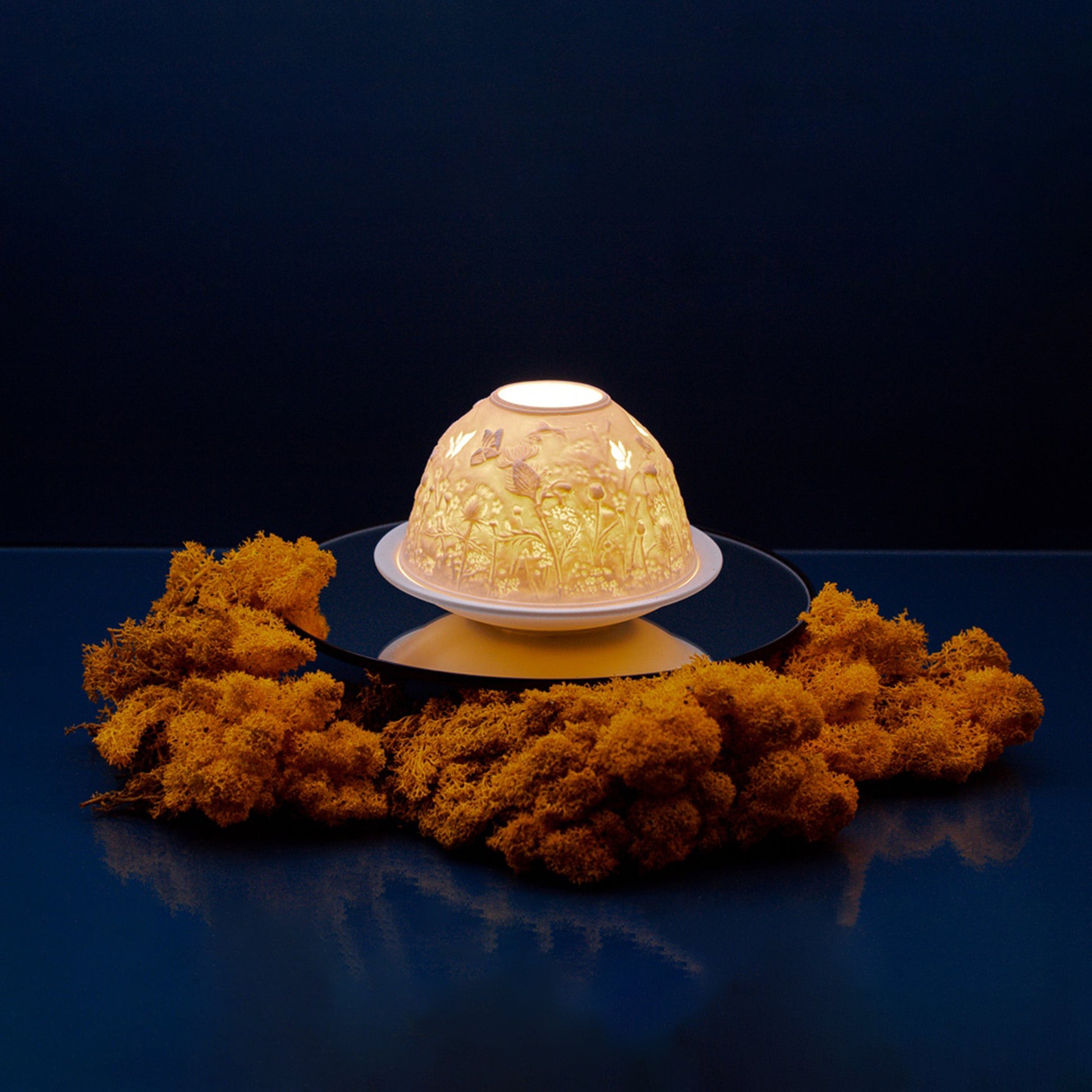 White porcelain tall dome candle holder with engraved thistles design lifestyle