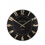 A simple and modern round wall clock in a black colour with gold hands and numbers
