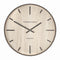 A wall clock with light wood effect face and simple number markings and hands