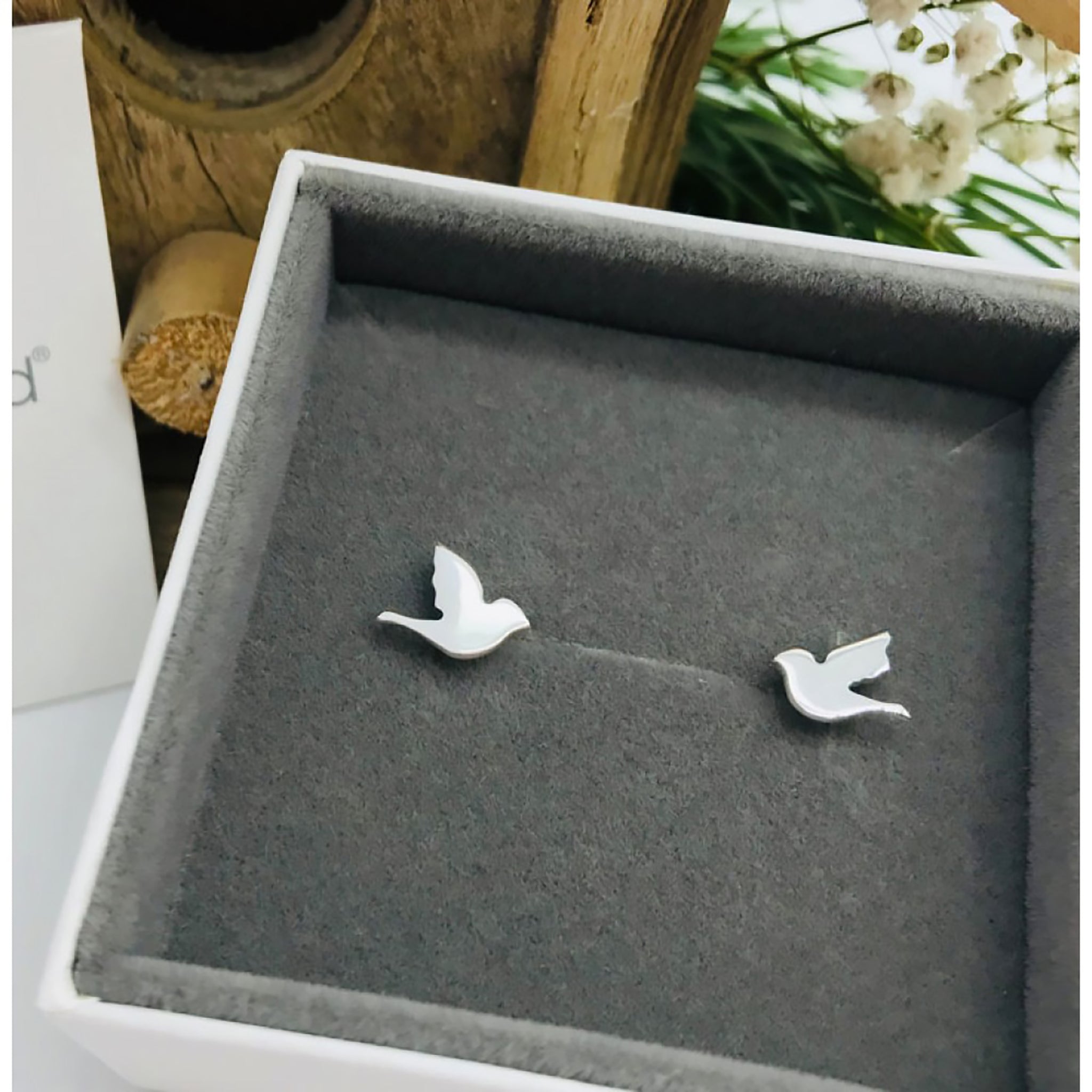 Simple silver bird shaped earrings with stud fittings in box