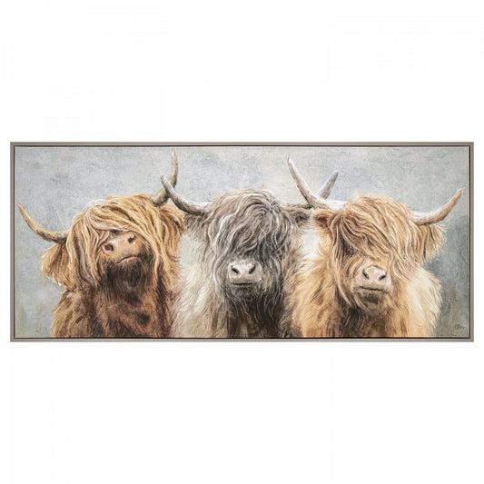 Long framed canvas of three Highland cows in a row with an impressionist grey background of foliage.