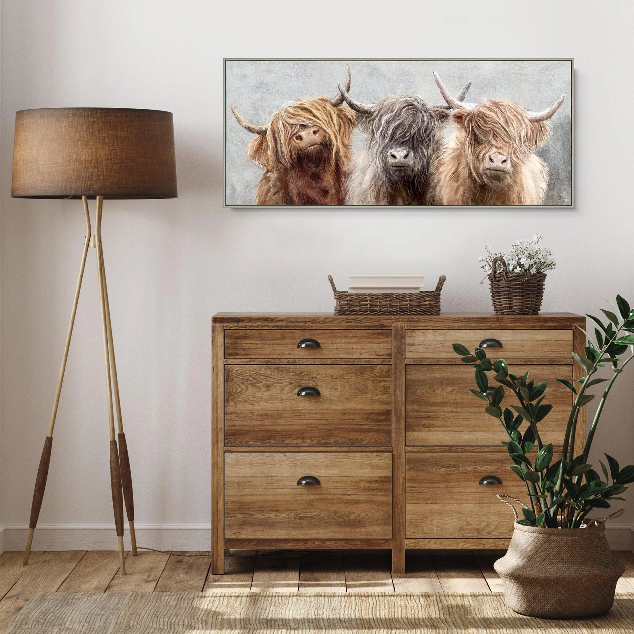Long framed canvas of three Highland cows with an impressionist grey background of foliage hanging