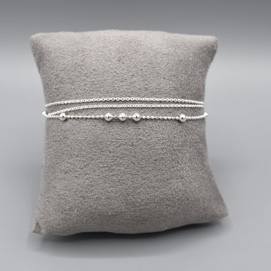 Bracelet with two delicate silver chains and one chain with spaced silver ball beads