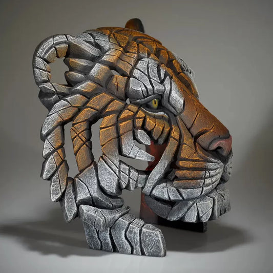 A textured and painted tiger bust sculpture side view