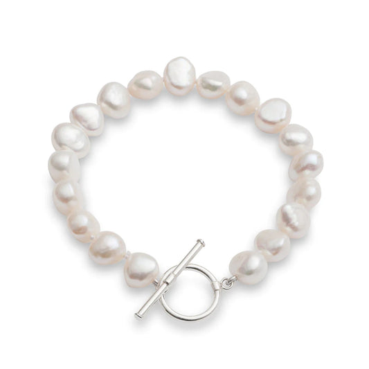 A silver toggle clasp bracelet strung with natural shaped white freshwater pearls