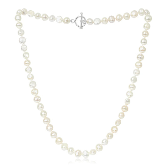 A silver toggle clasp necklace strung with natural shaped white freshwater pearls