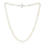 A silver toggle clasp necklace strung with natural shaped white freshwater pearls