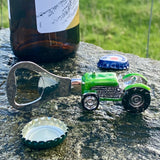 An enamelled bottle opener with a tractor shaped handle lifestyle