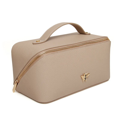 Stone faux leather cosmetic train bag with gold bee emblem and zip closure