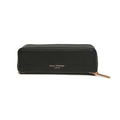 Back black faux leather cosmetic train bag with gold Alice Wheeler logo and zip closure