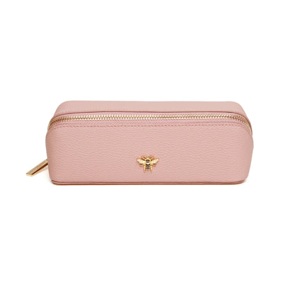 Pink faux leather cosmetic train bag with gold bee emblem and zip closure