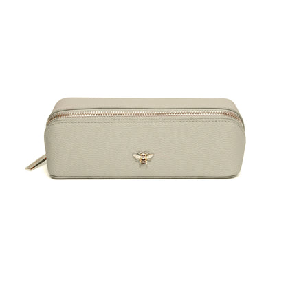 Pistachio green faux leather cosmetic train bag with gold bee emblem and zip closure