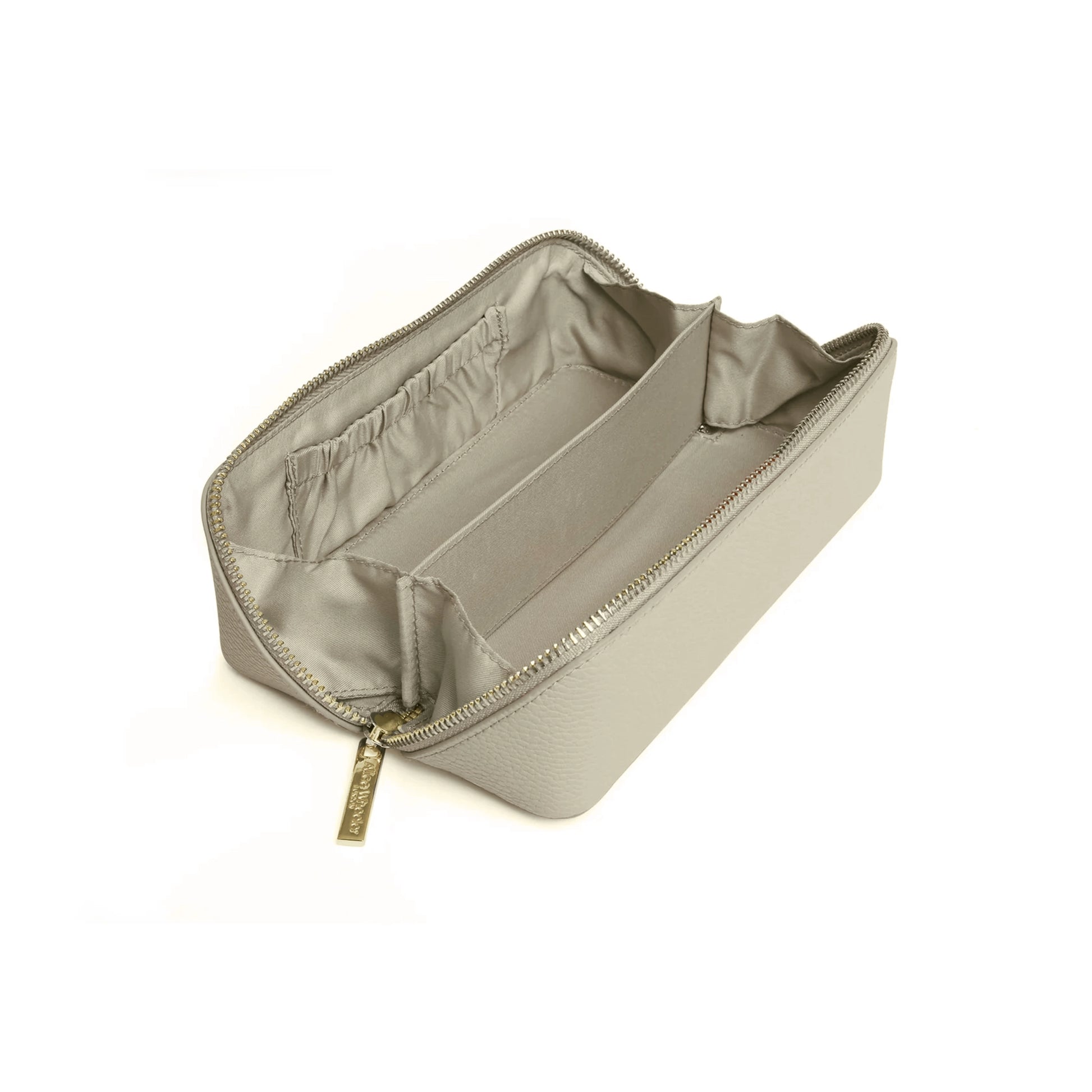 Open pistachio green faux leather cosmetic train bag with two large compartments and slip pockets 