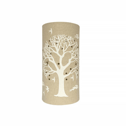 A linen look fabric table lamp with a love tree of life design and cut out birds