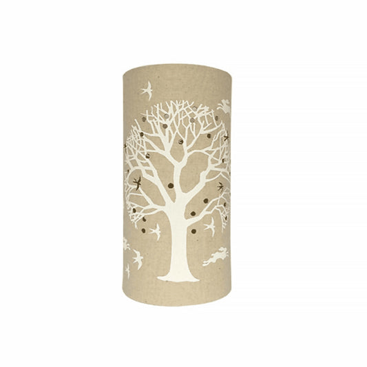 A linen look fabric table lamp with a love tree of life design and cut out birds