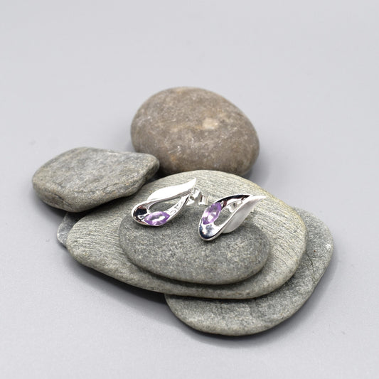 Silver studs featuring a twisted marquis shape with a marquis cut amethyst stone