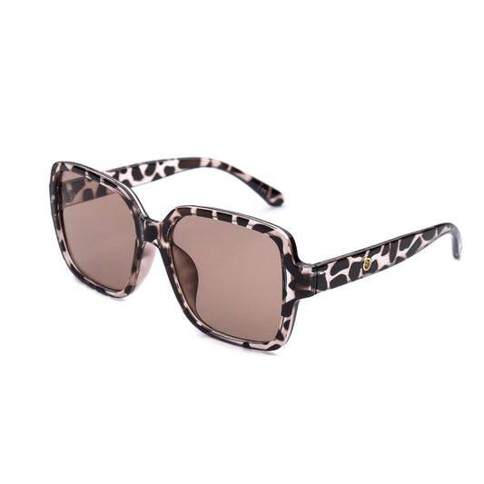 A pair of oversized square sunglasses with a spotted animal print pattern