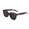 A pair of sunglasses with bold tortoiseshell pattern