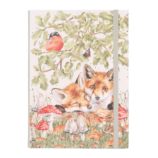 A notebook with fox and woodland illustrated cover and green elastic tie