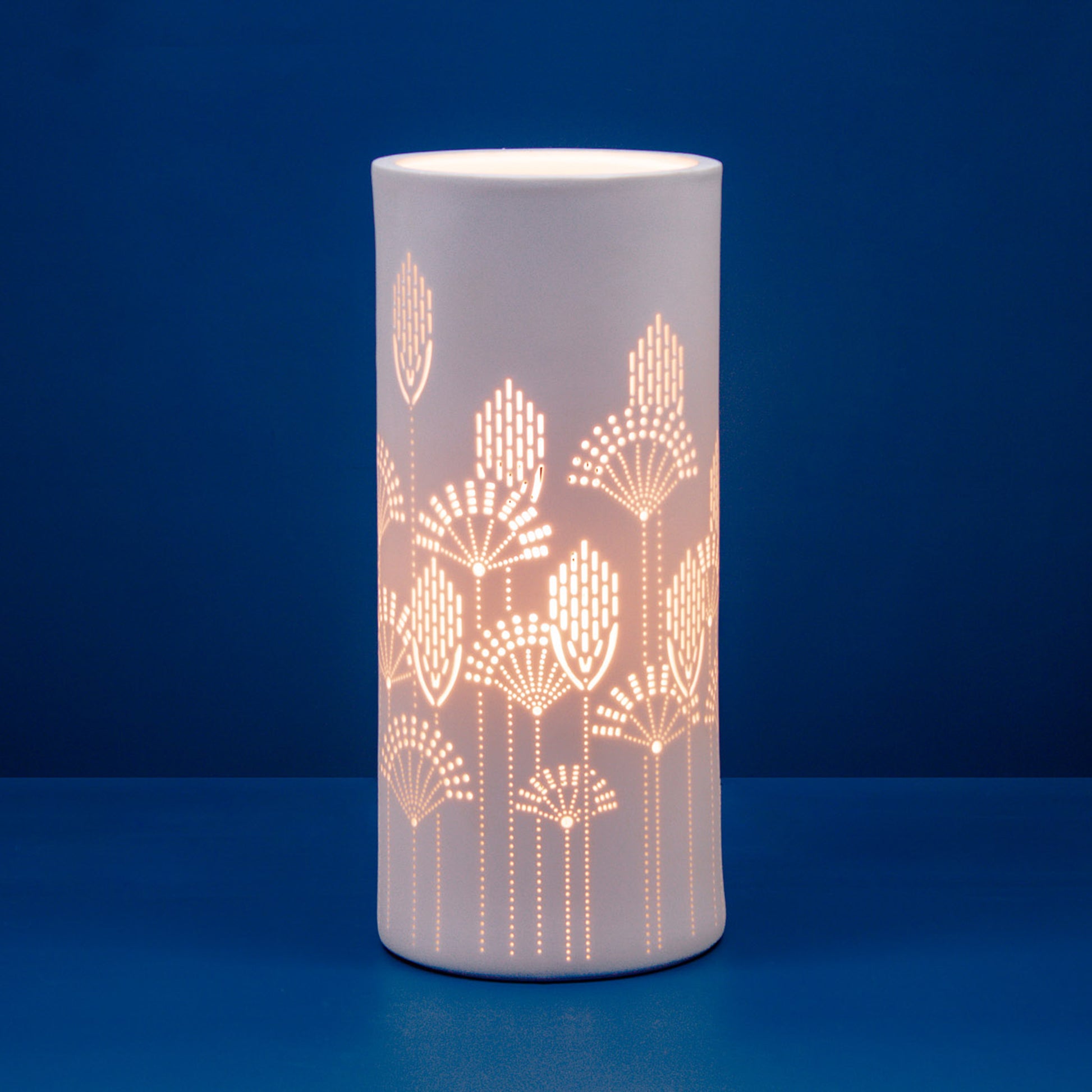 White porcelain column lamp with perforated floral vector design
