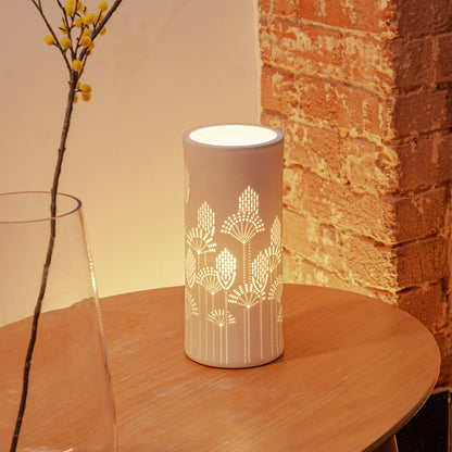 White porcelain column lamp with perforated floral vector design lifestyle