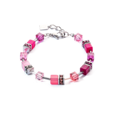 A steel bracelet featuring a variety of bright pink cube shaped stones and glass beads