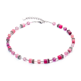 A steel necklace featuring a variety of bright pink cube shaped stones and glass beads