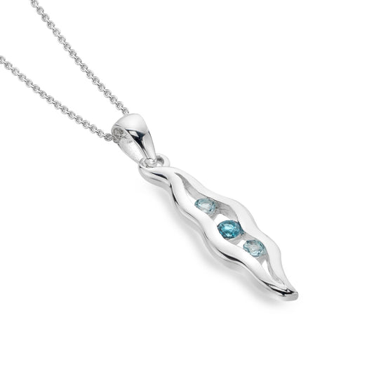A silver double wave shaped pendant with three blue topaz stones in the centre