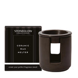 A ceramic black tealight wax melter with box