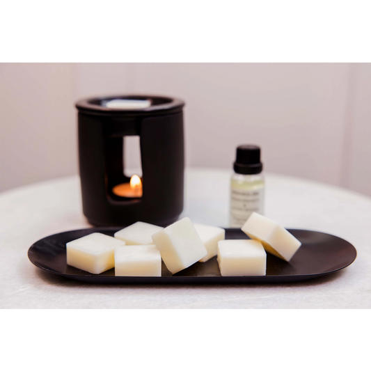 A ceramic black tealight wax melter lifestyle image