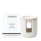 A ceramic white tealight wax melter with box