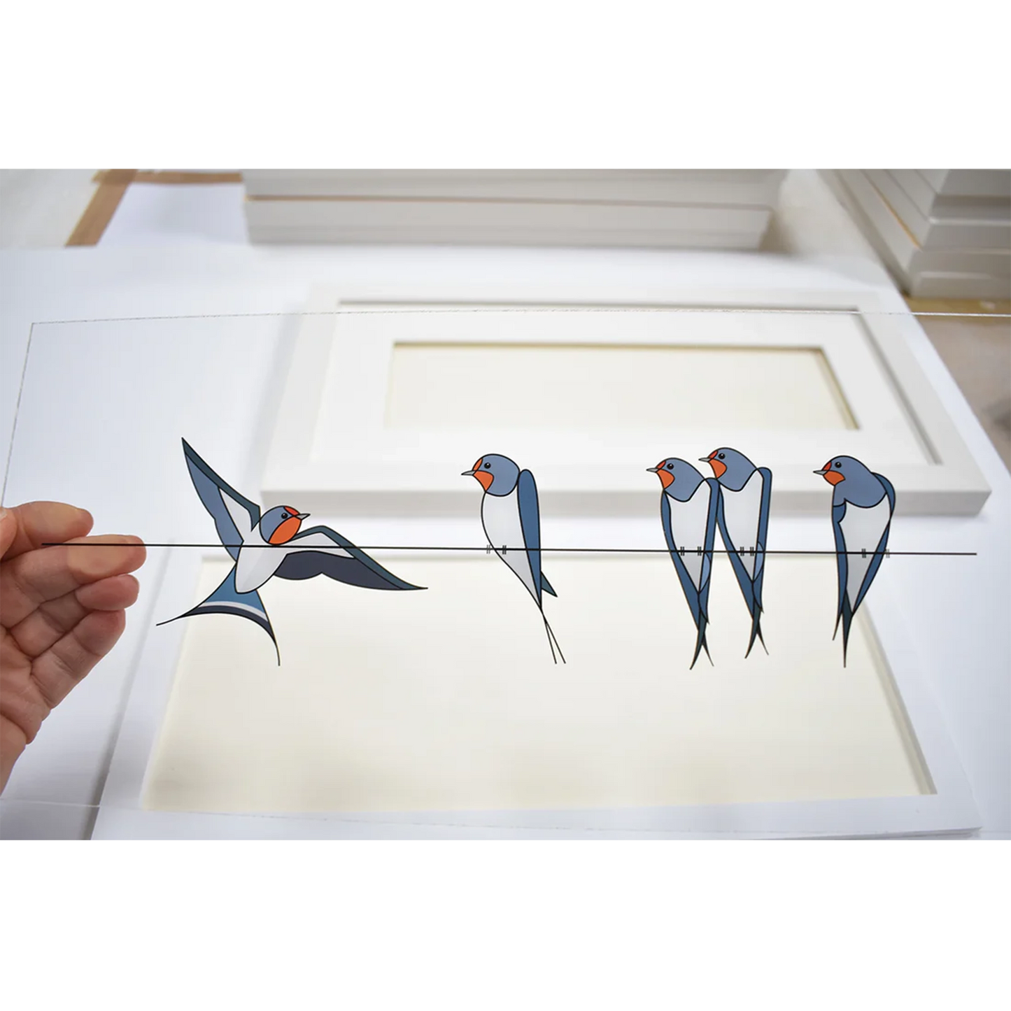 Acrylic art insert featuring a group of swallows on a wire