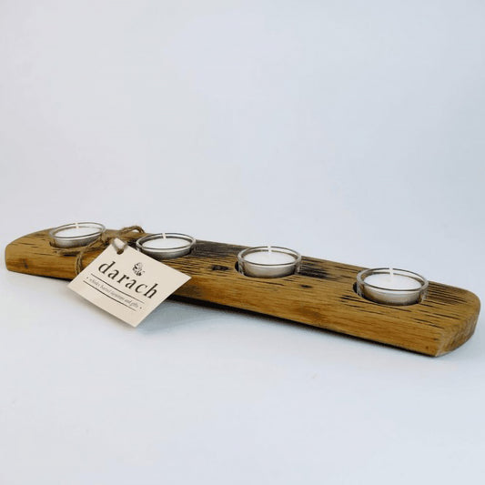 Long wooden tealight holder with four tealight candles in glass holders
