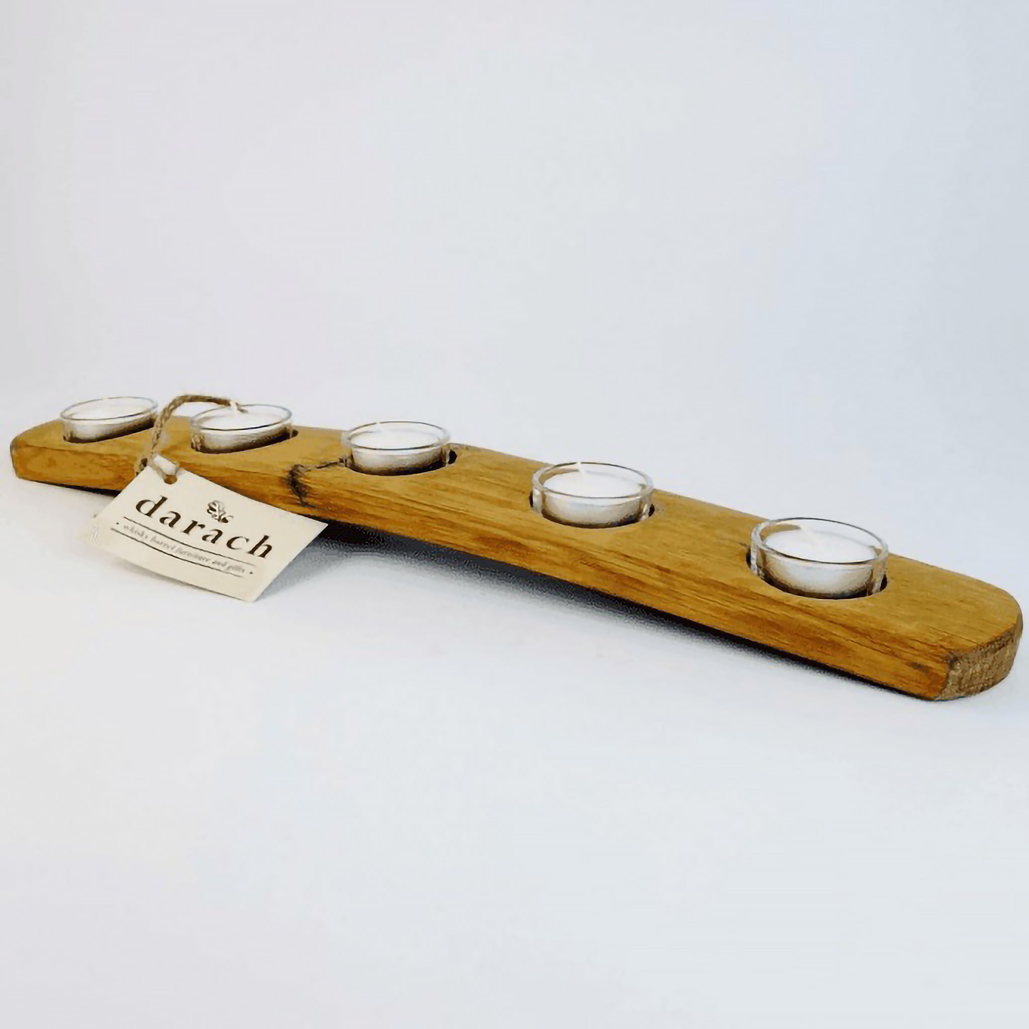 Long wooden barrel stave tealight holder featuring five tealights in glass holders