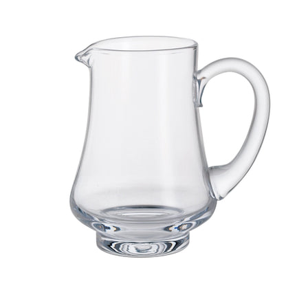 A glass jug with a wide base and handle