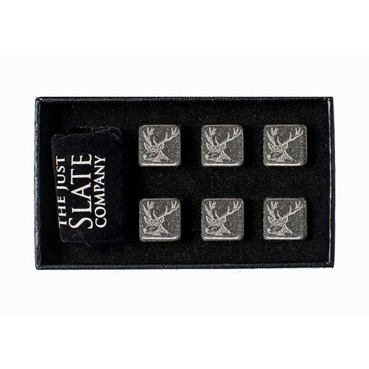 A box of 6 whisky stones engraved with stag heads and a velvet bag