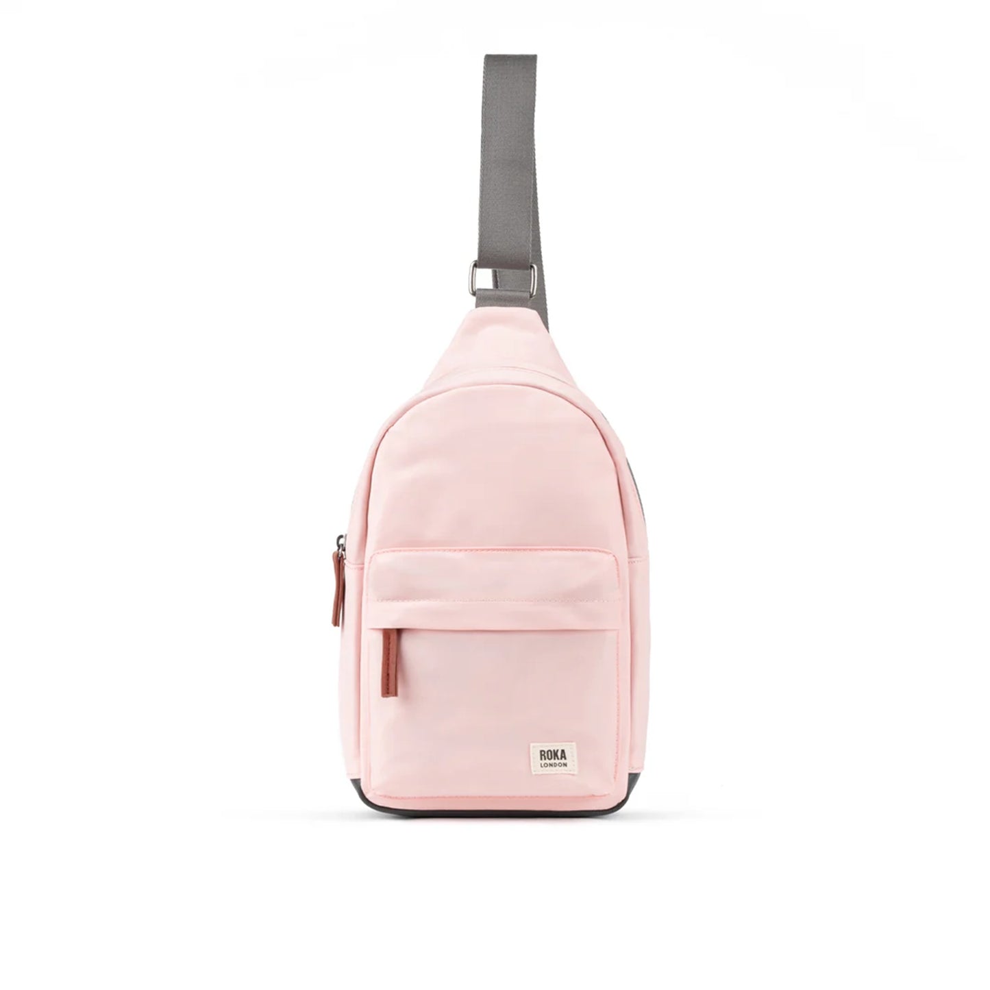 Pale pink crossbody sling bag with grey nylon strap