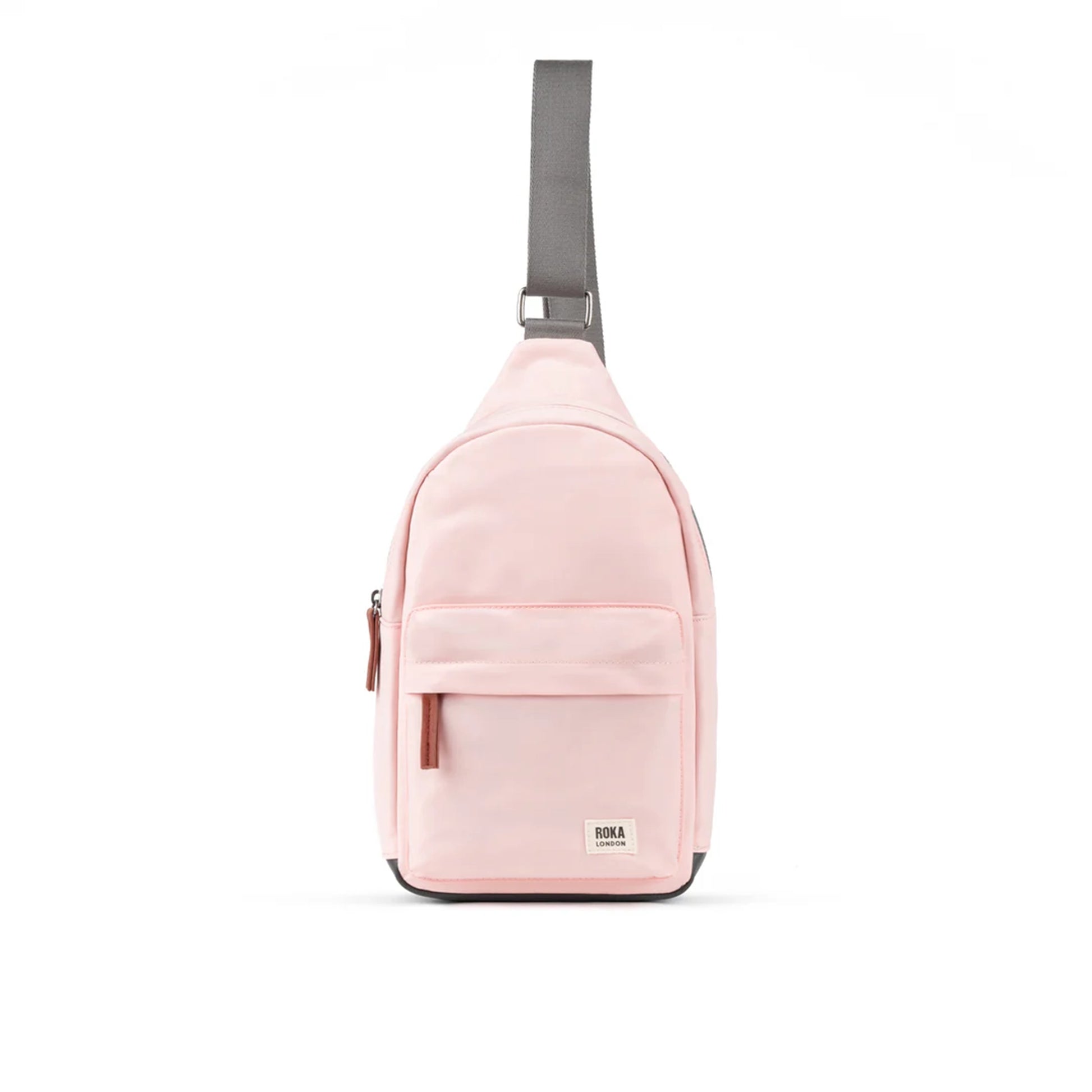 Pale pink crossbody sling bag with grey nylon strap