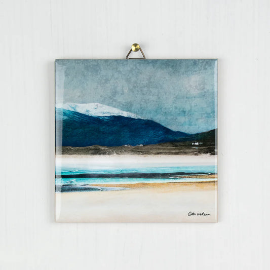 A ceramic tile featuring a seaside scene painting by Cath Waters