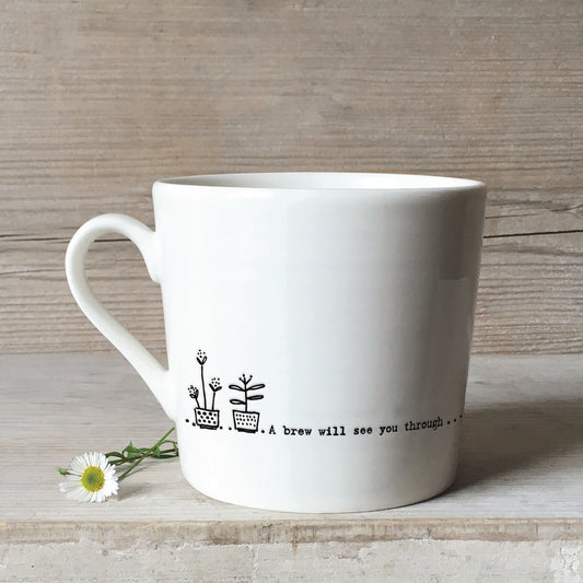 A white ceramic mug with a plant pot illustration and a quote