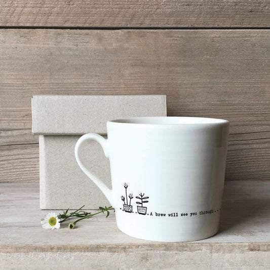 A white ceramic mug with a plant pot illustration and a quote with a box