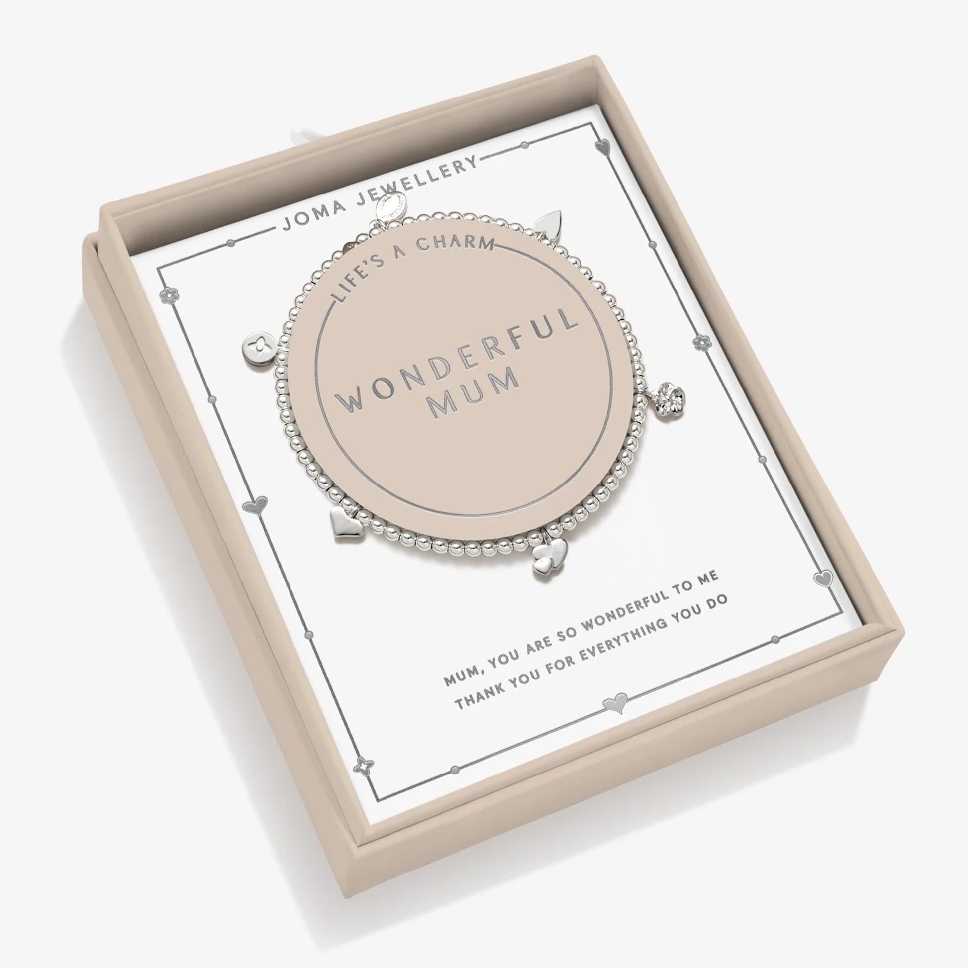 A beaded stretch silver bracelet in box that says Wonderful Mum, with five charm hearts and flowers, and a sentiment