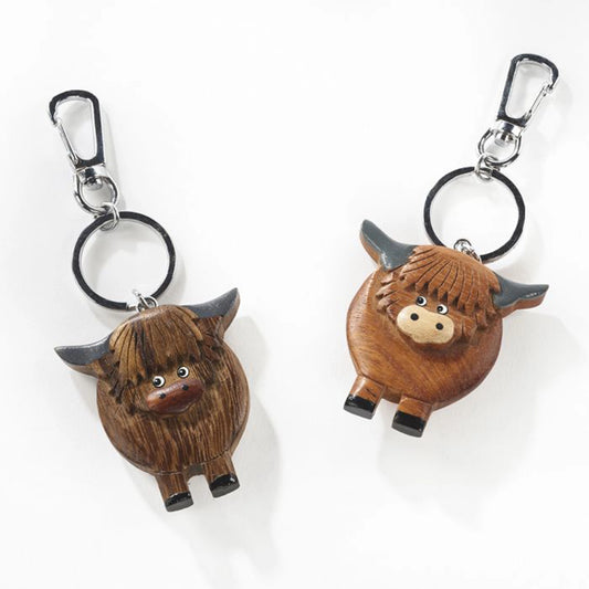 A wooden Highland cow keyring