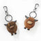 A wooden Highland cow keyring