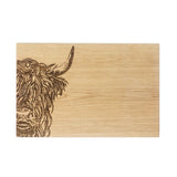 Wooden cutting board with engraved Highland cow