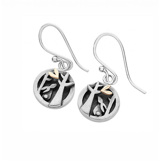 Pair of round silver earrings with bunny and tree details and a little gold heart on hook fittings