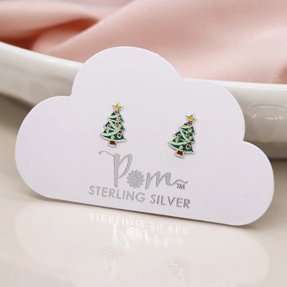 Pair of silver stud earrings shaped like Christmas trees with enamelled details on card