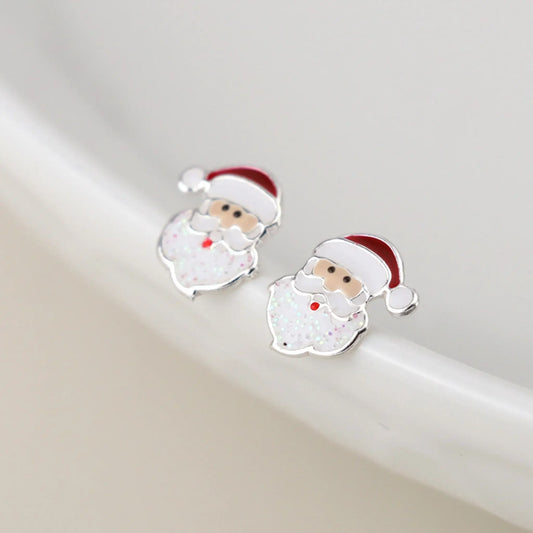 Pair of silver stud earrings shaped like Santa clause with enamelled details